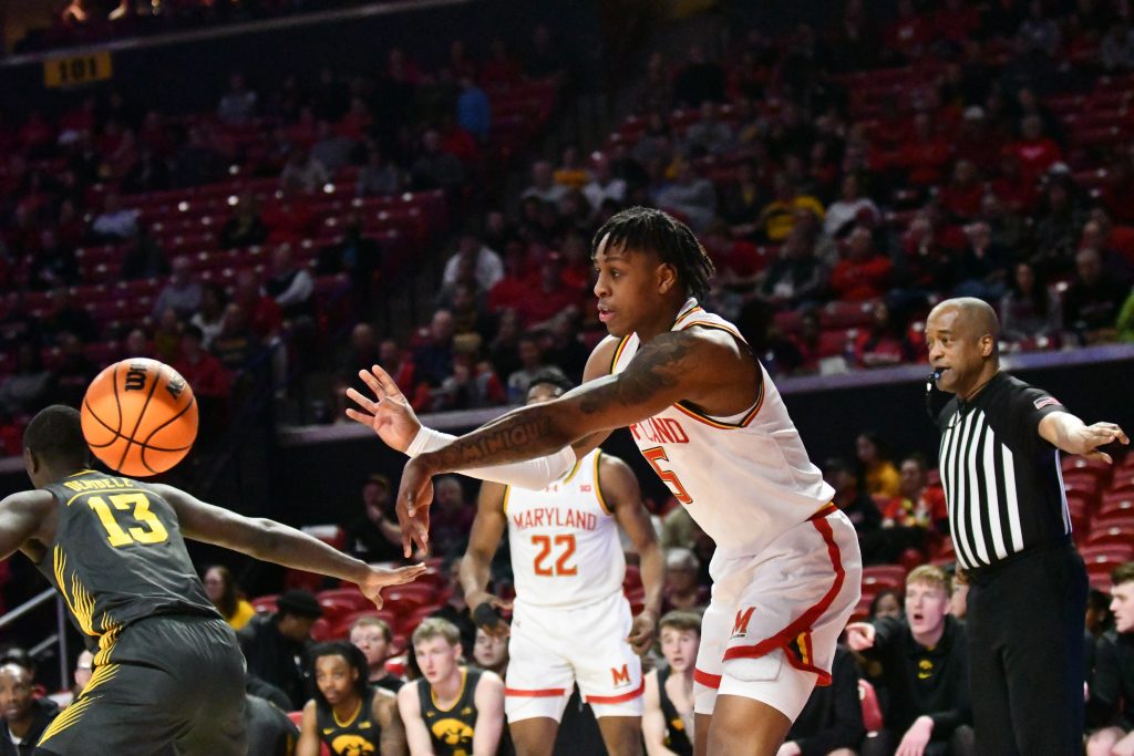 DeShawn Harris-Smith passes the ball during Maryland men's basketball's 78-66 win against Iowa on Feb. 14, 2024. (Jordan Budney/The Diamondback)